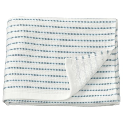 Serviette blanche à rayures bleues, pliée, avec bords garnis, en 100 % coton.