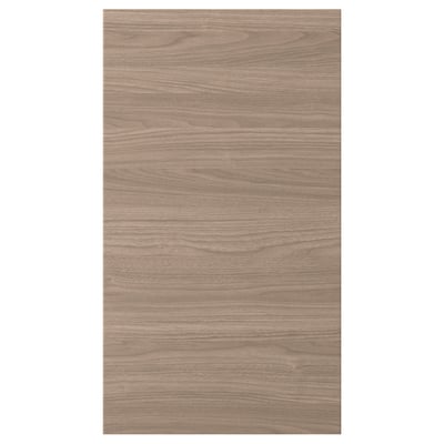 Une porte d’armoire de cuisine BROKHULT avec une texture de noyer naturel. Il a une forme rectangulaire avec des lignes simples et une surface lisse et facile à nettoyer.