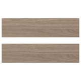 Deux panneaux de bois, brun clair, rectangulaires, texture lisse. Design BROKHULT, surface à motif noyer.