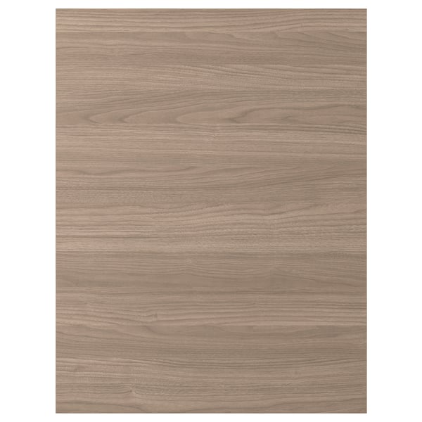 Une façade d’armoire de cuisine à motif noyer BROKHULT, dotée d’un aspect bois lisse et chaleureux avec une garantie de 25 ans.