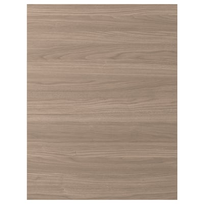 Une façade d’armoire de cuisine à motif noyer BROKHULT, dotée d’un aspect bois lisse et chaleureux avec une garantie de 25 ans.