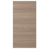 Une porte d’armoire de cuisine BROKHULT avec une surface à motif noyer brun clair, au design lisse et naturel.
