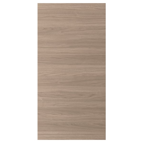Une porte d’armoire de cuisine BROKHULT dans une finition noyer brun clair avec des lignes droites et une texture lisse.
