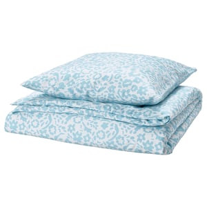 Parure de lit CYMBALBLOMMA : imprimé floral bleu et blanc, polyester recyclé doux, forme carrée pliée.