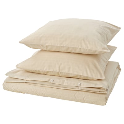 Couette beige DOFTAKLEJA avec motif en coton à carreaux et rayures.