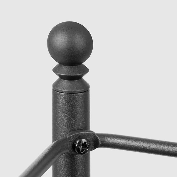 Clôture noire avec boutons supérieurs ronds.