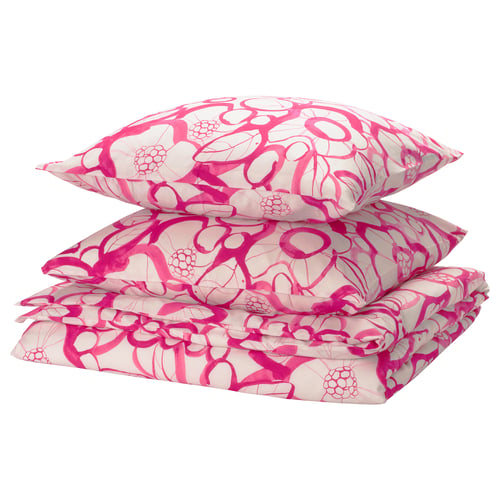 Ensemble de literie rose, à motifs floraux, en coton recyclé et en lyocell, soigneusement plié.