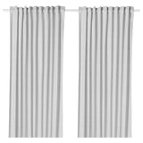Les rideaux blancs HANNALILL, fabriqués à 100 % en coton, présentent un design simple et élégant avec des passe-tringles pour une suspension facile, offrant intimité et contrôle de la lumière.
