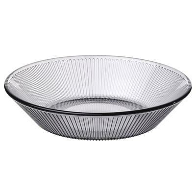 Assiette plate en verre gris HAVSGÄDDA, ronde avec un motif strié.