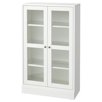 Armoire en bois blanc HAVSTA avec portes vitrées, élégante et moderne, expose des articles, quatre étagères intérieures.