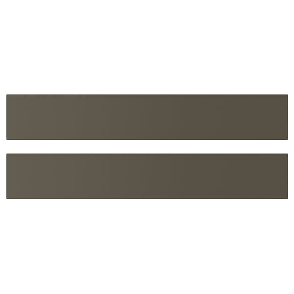 Deux étagères HAVSTORP en brun foncé/beige. Ils sont rectangulaires avec des surfaces lisses et des lignes épurées. Fabriqué en peinture acrylique et en panneaux de fibres.