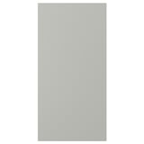 Une porte d’armoire de cuisine HAVSTORP grise avec une finition lisse et sans couture.