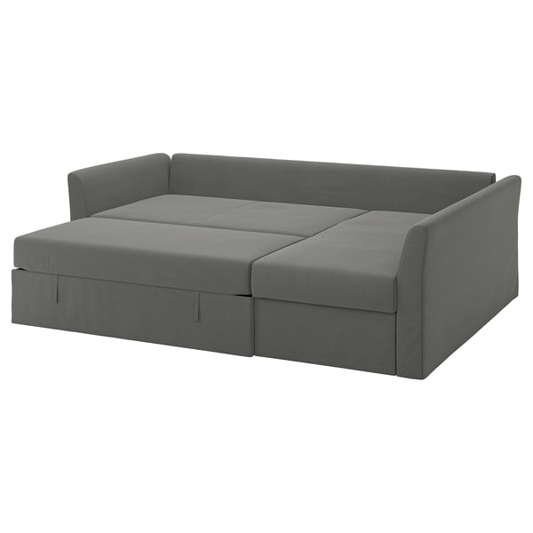 Un canapé-lit HOLMSUND gris avec revêtement gris, doté d’un espace de rangement intégré et convertible en lit.