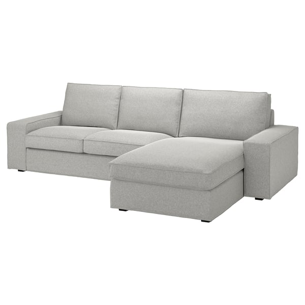Canapé sectionnel KIVIK, gris clair, accoudoirs bas, coussins profonds, housses amovibles. Parfait pour la détente, la déco minimaliste.