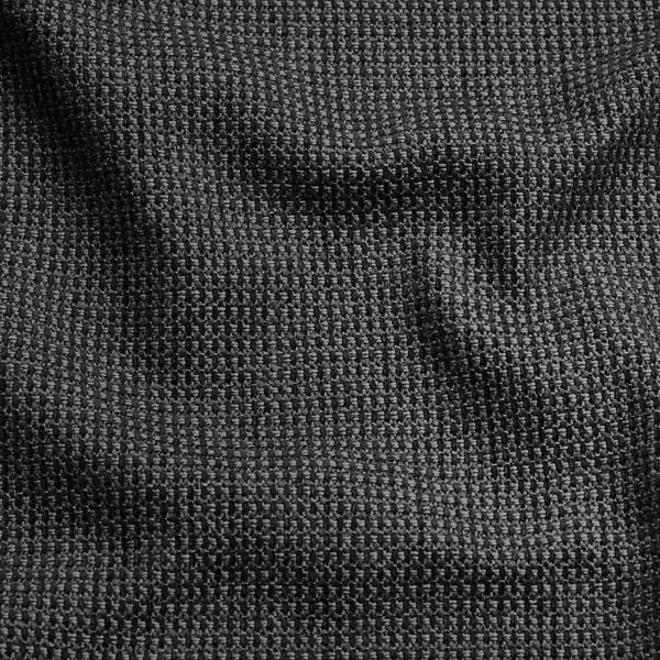 Gros plan du tissu KIVIK à la texture bicolore, montrant un mélange de coton recyclé et de polyester doux et brillant.