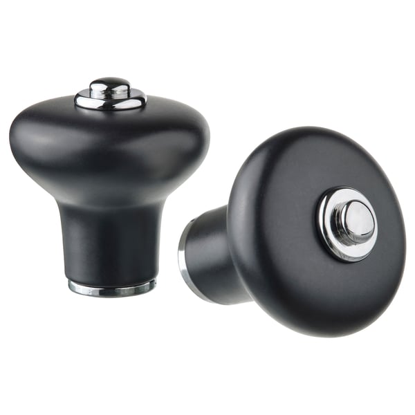 Deux boutons Klingspor noirs, aspect porcelaine mate, de forme ronde avec des plateaux chromés, conçus pour une prise en main facile.