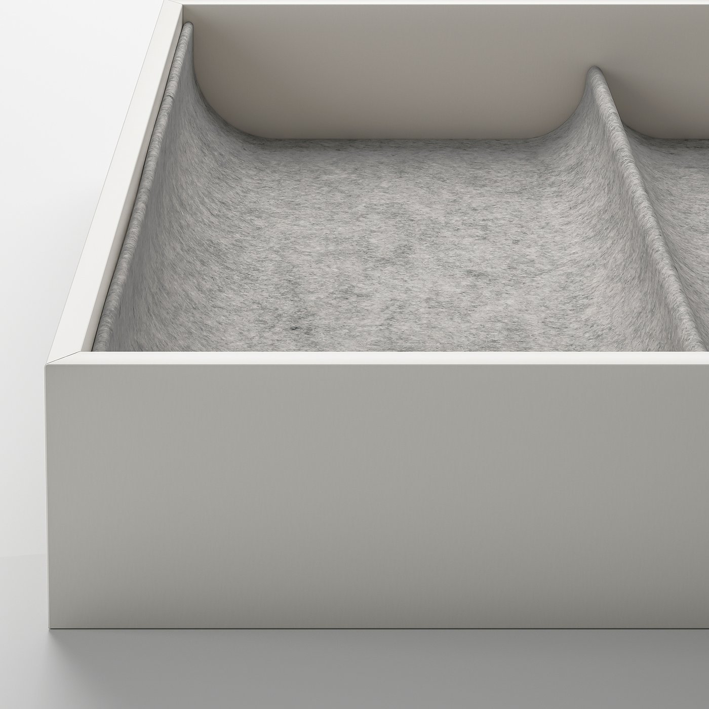 Boîte doublée de tissu gris avec compartiments pour organiser les cravates ou autres accessoires.