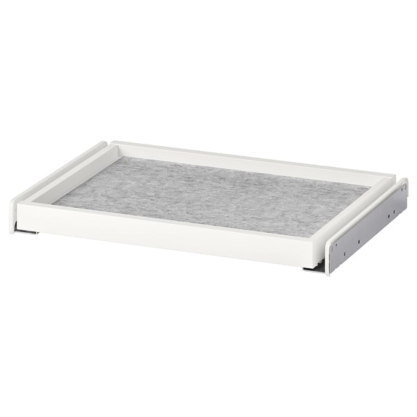 Tiroir coulissant blanc KOMPLEMENT avec tapis en feutre, pour organiser les objets dans l’armoire.