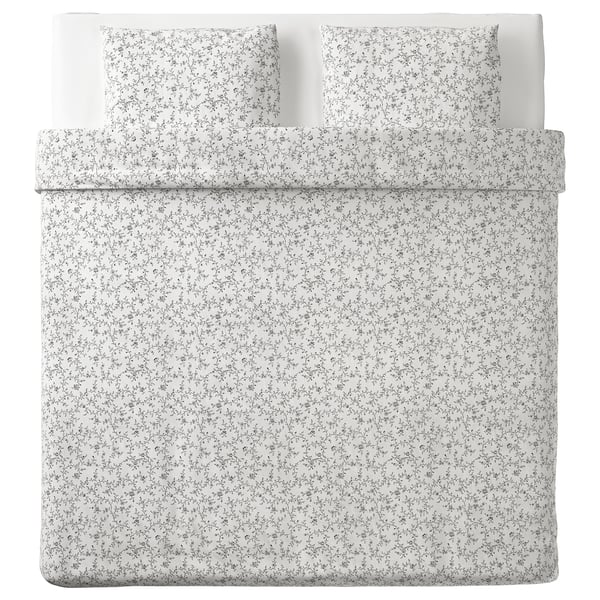 Housse de couette et taies d’oreiller à fleurs blanches KOPPARRANKA. Mélange doux de coton et de viscose, motif floral, forme carrée avec motif floral.