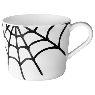 Tasse en céramique blanche avec design Web noir, forme ronde, grande poignée.
