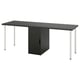 Bureau LAGKAPTEN noir avec pieds blancs et tiroir central.