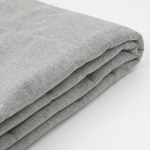 Tissu gris plié à texture fine ; Semble doux, durable et recyclé.