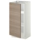 Une armoire de cuisine METOD moderne, blanche avec une porte à motif de noyer, une construction robuste et des étagères réglables.