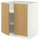 Unité de rangement METOD : base blanche, portes en chêne clair, forme rectangulaire, étagères réglables.