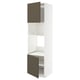 Unité de cuisine Ikea METOD avec portes brun foncé, intérieur blanc et étagères réglables.