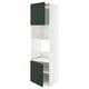 Grande armoire blanche avec portes vertes, étagères réglables.