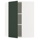 Une armoire verte du système de cuisine METOD avec une porte ouverte, révélant une seule étagère réglable à l’intérieur.