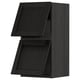 Armoire de cuisine METOD noire, rectangulaire, en bois avec bords biseautés et porte fermée.