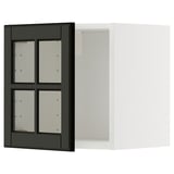 Armoire de cuisine noire et blanche avec portes vitrées, design moderne et élégant.