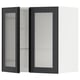 Armoire noire moderne avec portes en verre nervuré et étagère réglable.