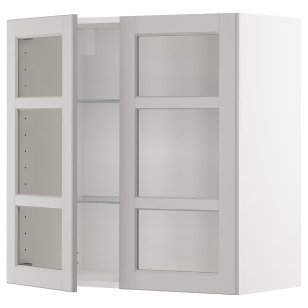 Armoire de cuisine murale blanche avec portes vitrées, avec étagères réglables.
