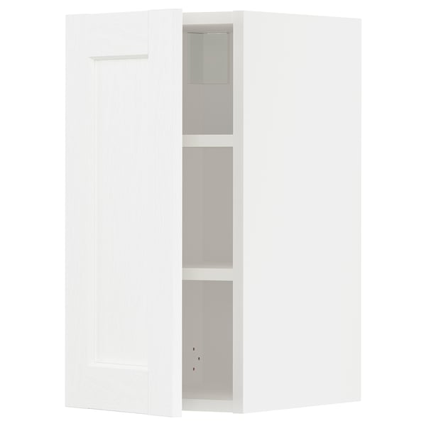 Un meuble de cuisine METOD blanc au design minimaliste, doté d’étagères réglables et de dimensions adaptées à une configuration de cuisine moderne.