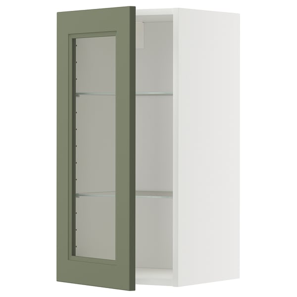 Armoire murale à porte en verre vert avec intérieur blanc.