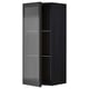 Une armoire de cuisine izquierda noire avec une porte en verre texturé et un cadre en métal. C’est un look moderne et élégant avec une poignée sur la porte.