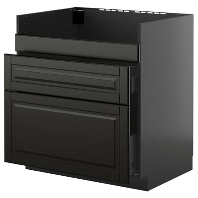 Unité de cuisine moderne noire avec des façades de tiroirs élégantes et une finition brillante, qui fait partie du système de cuisine METOD.