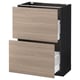 Une armoire de cuisine IKEA METOD avec un cadre noir et des tiroirs de couleur bois clair, dotée d’un design moderne.