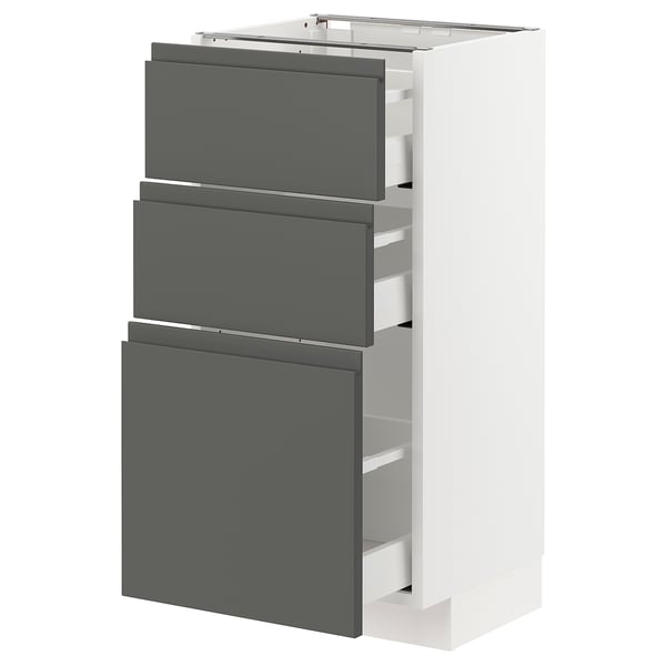 Armoire de cuisine METOD moderne blanche avec tiroirs gris foncé et poignées intégrées.