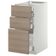 Armoire metzod blanche avec tiroirs en noyer dans une configuration de cuisine moderne.