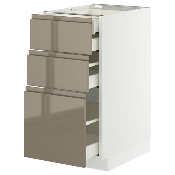 Armoire de cuisine moderne avec trois tiroirs en bronze, finition brillante, poignées élégantes, base blanche robuste, design élégant.