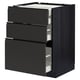 Armoire de cuisine noire moderne avec trois tiroirs ouverts. Design élégant sans poignée, finition grain de bois foncé.