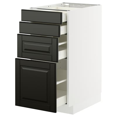 Armoire de cuisine moderne noire et blanche avec bords biseautés et tiroirs coulissants.