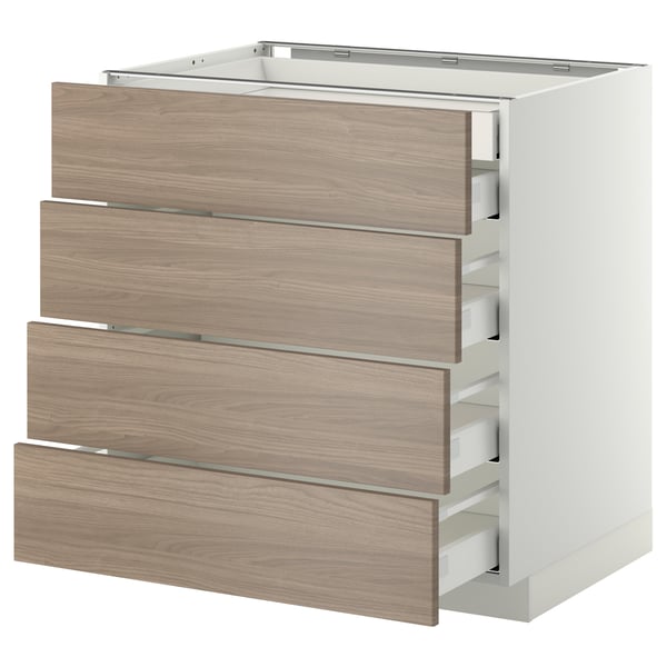Meuble de cuisine moderne en bois clair avec quatre tiroirs bas, poignées élégantes et glissières métalliques, qui fait partie du système METOD.