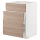 Armoire de cuisine blanche moderne avec trois tiroirs en bois brun clair.