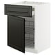 Tiroir noir à bord biseauté sur armoire METOD blanche, ouvert, mettant en valeur des grilles.