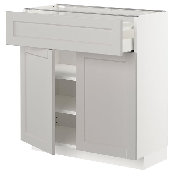 Armoire de cuisine blanche avec tiroirs et étagères réglables. Design moderne et épuré.