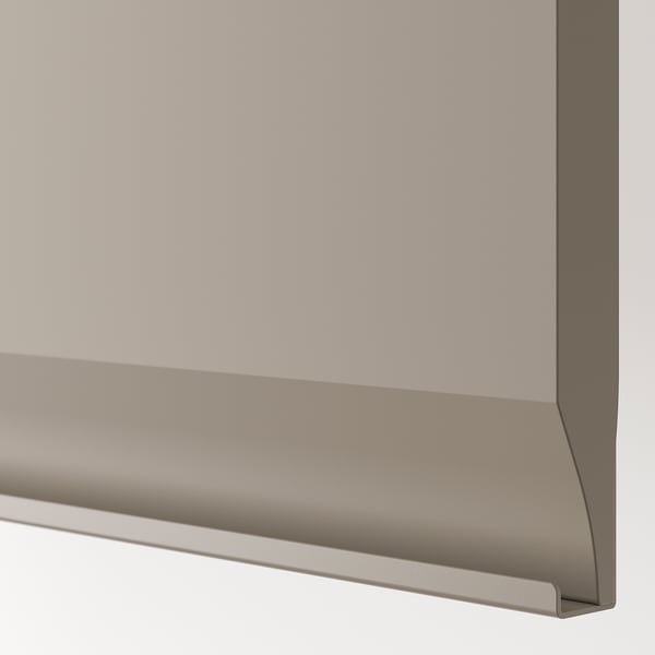 Gros plan d’armoire de cuisine moderne : finition gris-beige élégante, poignée intégrée, bord chanfreiné propre.